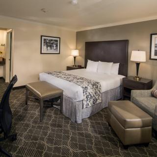 Best Western Danville Sycamore Inn | Danville, California | King bed with chair and foot stool